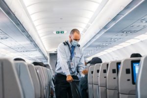 Man cleaning plane