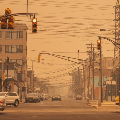 What are the effects of wildfires and hot temperatures on outdoor and indoor air quality in Northeast US?